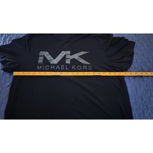 Michael Kors black t-shirt featuring a large, vertical metallic silver logo. - Picture 7 of 7